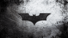 the batman logo is on a metal surface .