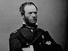 a black and white photo of a man with a beard wearing a military uniform