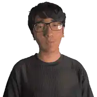 a man wearing glasses and a black shirt that says dawson on it