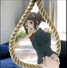 a person is holding a rope with a picture of a girl on it