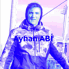 a man in a camouflage jacket with the name ayhan abi on it