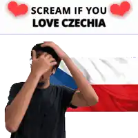 a man covering his face with his hands in front of a czechia flag