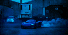 a blue car is drifting in front of a container that says turbo on it