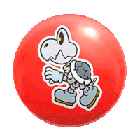 a red ball with a sticker of a skeleton holding a turtle on it