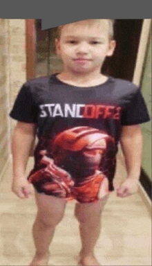 a boy wearing a shirt that says standoff 2 on it