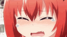 a close up of a crying anime girl with red hair .