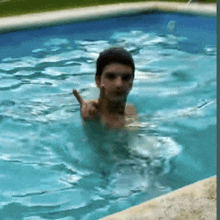 a man is giving the middle finger in a swimming pool