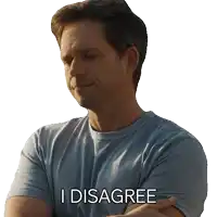 a man with his arms crossed has the words i disagree on his shirt