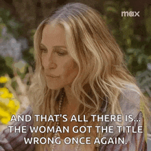 a woman is sitting in a garden with flowers and a quote that says and that 's all there is