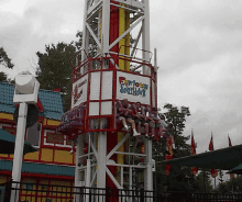 a group of people are riding a roller coaster called funhouse overhead