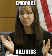 a woman with glasses is making a funny face with the words embrace silliness below her