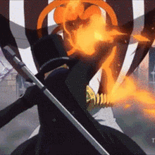 a man in a top hat is holding a sword in front of a flame .