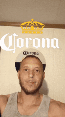 a man wearing a corona hat stands in front of a corona sign