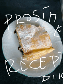 a piece of pastry with powdered sugar on it is on a white plate with the words prosim recept dik written on it