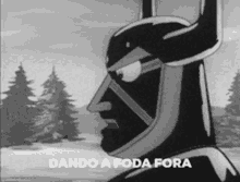 a black and white photo of a cartoon character with the words dando a foda fora written on it .