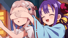 a girl with purple hair is covering another girl 's eyes with her hands