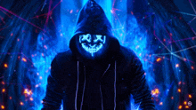 a man in a hoodie has a neon mask on his face .