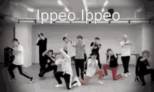 a group of young men are dancing in a room with the words ippeo ippeo written above them