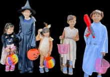 a group of children dressed in halloween costumes