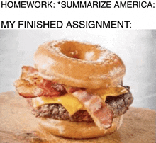 a hamburger with bacon , cheese , and a donut on top of it .