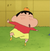 a cartoon character is holding an orange in his hands