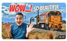 a man in a blue shirt with the word boss on it stands in front of a train