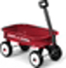 a red wagon with white wheels and a handle on a white surface .