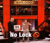 a man stands in front of a sign that says $ 25,000
