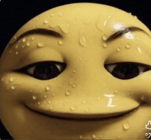 a close up of a yellow smiley face with a thumbs up