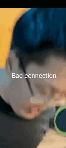 a close up of a person 's face with the words `` bad connection '' written on the bottom .