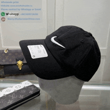 a black nike hat with a white swoosh on it