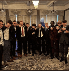 a group of young men posing for a picture in a room