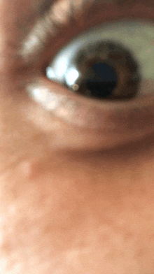 a close up of a person 's eye shows the pupil