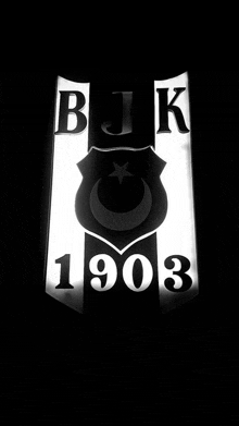 a black and white logo that says bjk 1903 on it