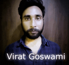 a man with a beard and the name virat goswami written below him