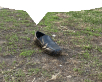 a black shoe is laying on the ground with a white speech bubble above it