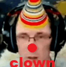 a man wearing headphones and a clown hat on his head