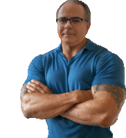 a man in a blue shirt has his arms crossed