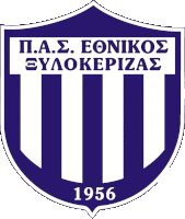 a blue and white emblem with the year 1956 on it