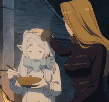 a woman petting another woman 's head who is holding a bowl