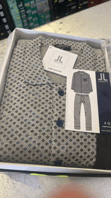 a jl lancetti pajama set in a white box