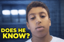 a young man with the words " does he know " above him