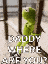 kermit the frog is sitting on a railing with the words `` daddy where are you '' .