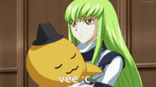 a girl with long green hair is holding a stuffed animal that says vee c.