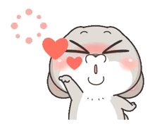 a cartoon rabbit is blowing a kiss with a heart in front of his eyes .