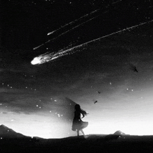 a black and white photo of a girl watching a comet