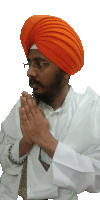 a man wearing an orange turban is praying with his hands together