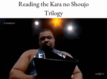 a man reading a book with the words reading the kara no shoujo trilogy at the top