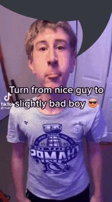 a young man wearing a t-shirt that says ' turn from nice guy to slightly bad boy '