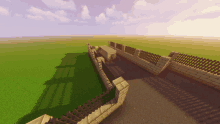 a brick wall with a wooden fence in a minecraft game